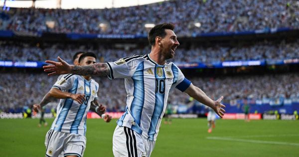 With a historic Messi, Argentina begin their title defense by thrashing Algeria