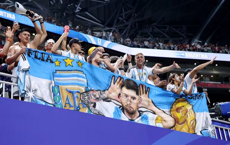 Argentina fans display a Lionel Messi banner after the match as Argentina qualify for the quarter finals of the World Cup. Photo: Brett Davis-Imagn
