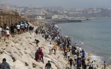 Spain's Interior Ministry put at around 50,000 the number who entered since Thursday and at 48,300 those who had already returned voluntarily to Morocco, according to its latest Friday update