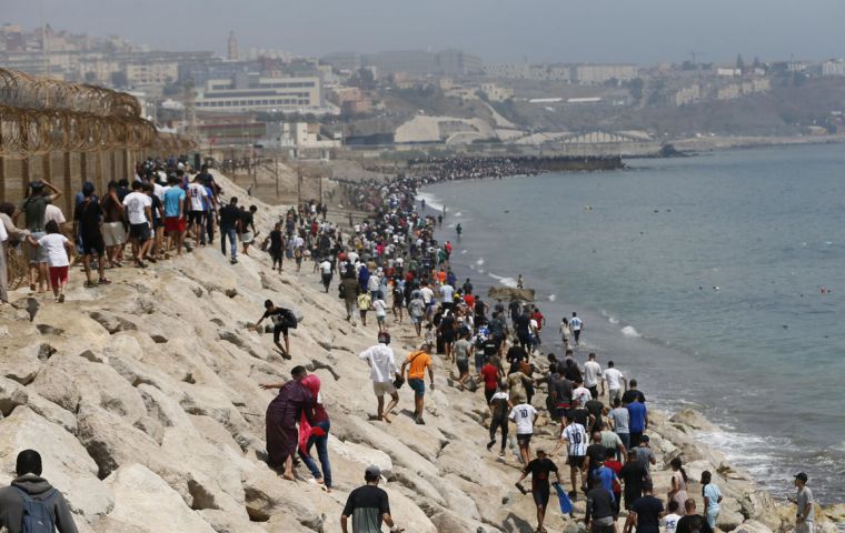 Spain's Interior Ministry put at around 50,000 the number who entered since Thursday and at 48,300 those who had already returned voluntarily to Morocco, according to its latest Friday update