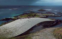 The low, curved concrete roof, which is covered in stones, doubles as a viewing platform, giving visitors a chance to spot the many species of whales