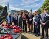 Hyslop with Lord West of Spithead (central) and Chris Locke (right), former Royal Fleet Auxiliary (RFA) Chief Officer, Marine Officer, alongside other attendees at the Navy Day Memorial
