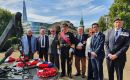 Hyslop with Lord West of Spithead (central) and Chris Locke (right), former Royal Fleet Auxiliary (RFA) Chief Officer, Marine Officer, alongside other attendees at the Navy Day Memorial