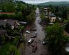 A mudslide sweeps away cars and a bus in Santiago after the wettest October on record