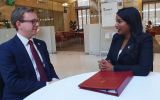 Minister Uma Kumaran and  MLA Jack Ford in discussion following her statement to Parliament