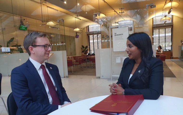 Minister Uma Kumaran and  MLA Jack Ford in discussion following her statement to Parliament