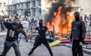 From early afternoon, groups built barricades from burning rental bicycles in the streets around the square and looted some shops, while police responded with tear gas