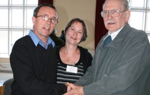John Birmingham and his wife Louise are congratulated by John's proposer, Nick Hadden.