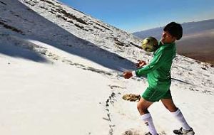Pte. Morales playing soccer on the mountains