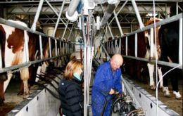 Kevin demonstrates the new milking parlor's capabilities to Sarah Clements of SeAled PR