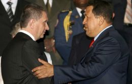 Pte. Chavez (R) greets Russia's Deputy PM Sechin during a meeting at Caracas last September