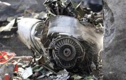 Debris is seen at the scene of a plane crash in Mexico City
