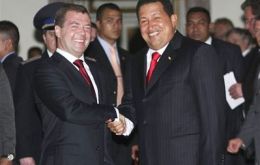 Russia's President Dmitry Medvedev, shakes hands with Venezuela's President Hugo Chavez