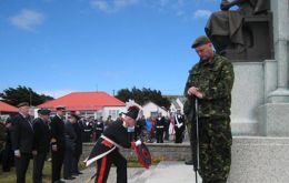 Gov. Alan Huckle lays a wreath at the Battle Day Memorial
