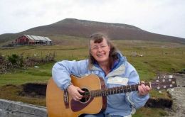 Shirley Adams-Leach having a musical moment on Saunders Is. West Falkland