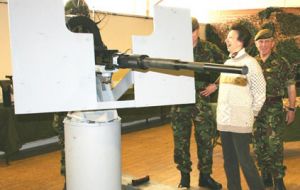 HRH Princess Anne shares a joke with Defence Force members displaying the Oerlikon 20mm cannon which is soon to be mounted on FPV Protegat.