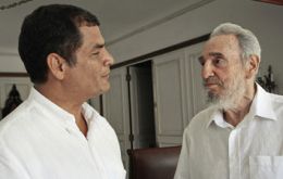 The photo from Juventud Rebelde shows a well-groomed Castro wearing a white short-sleeve shirt and standing face-to-face with Correa.