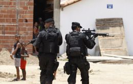 Police raids on the favelas are a common picture in 2016 Olympic city