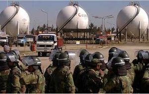 Bolivian soldiers stand watch next to the nationalized companies