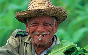 Cubans enjoying nature’s sun and the cheap cigarettes  