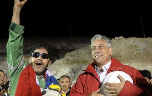 President Piñera  ® with the last miner to emerge and leader of the group Luis Urzua 