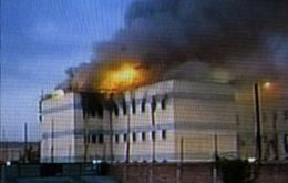 Television footage showed part of the San Miguel prison in flames