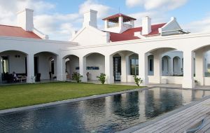 In a large garden, an Absolute Nero stone pool awaits you.