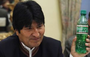 President Evo Morales holds up a bottle of Coca Brynco