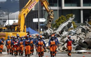 Rescue workers continue to search among the rubble 