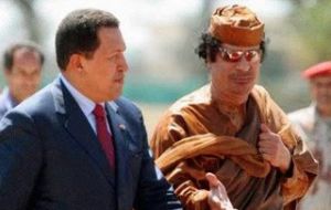 Hugo Chavez and good friend Gaddafi in less dangerous times 