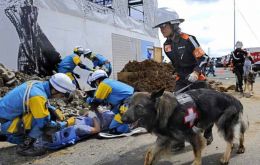 Search and relief efforts continue among the rubble