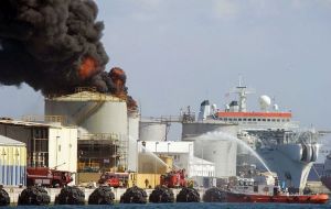 An oil tank burns in the port of Gibraltar (AFP, Marcos Moreno)
