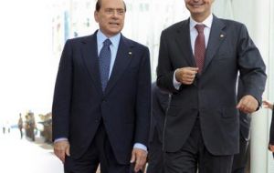 Rodriguez Zapatero postponed vacations and Silvio Berlusconi is to address Parliament (L)