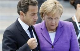 President Nicolas Sarkozy and German Chancellor Angela Merkel united in support of the Euro