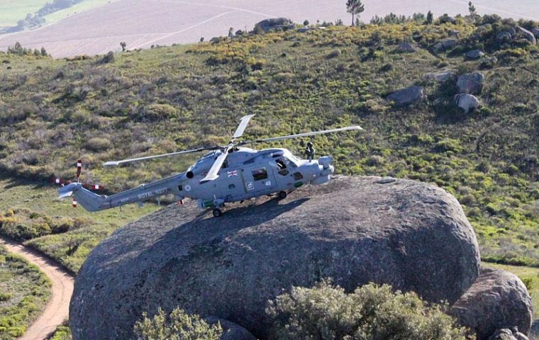 HMS Edinburgh's Lynx lands on a large boulder whilst conducting training with the South African Air Force's Super Lynx
