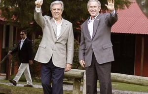 Former president Vazquez and George W Bush 

