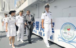 Jamaica's deputy prime minister, Dr Ken Baugh (2nd right), discussing Jamaica/China relations with Rear Admiral Qiu Yanpeng, deputy commander of the East China Sea Fleet

