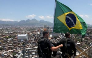 The Brazilian flag flies over Rocinha, the most notorious favela which is home to 150.000 people  