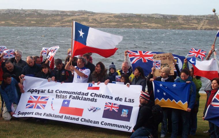 Chileans sang their national anthem and together with Islanders displayed the three flags  