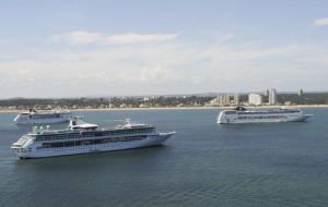 Several cruise vessels in the Bay of Maldonado waiting to land thousands of visitors 