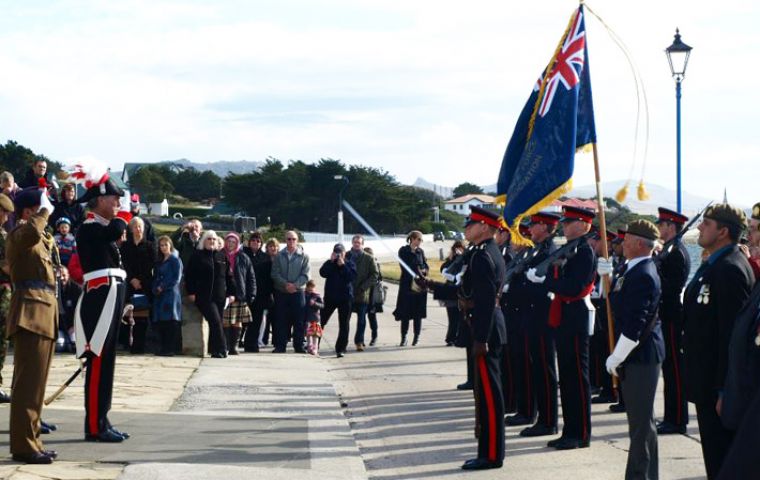 FIDF veterans parade at Liberation Monument with Governor Haywood and Commander Brigadier Bill Aldridge taking the salute. (Photo: Rosie King)