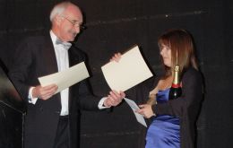 Sarah Clement accepts from Mike Summers MLA an award on behalf of her sister Debs Summers for Best Falkland Ambassador at the Tourism awards on Saturday night - Picture L Watson