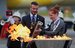 David Beckham lit a cauldron, to mark the flame's arrival on UK soil.