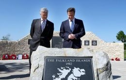David Cameron is accompanied by NMA chief executive Charlie Bagot-Jewitt during a visit to the Falklands Memorial (Photo: AP)