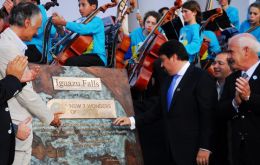 Weber (left) and Misiones governor Maurice Closs (right) unveil the plaque listing Iguazu Falls as one of the New7Wonders of Nature