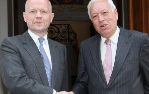 Hague and Garcia-Margallo pose for the classic picture following the meeting