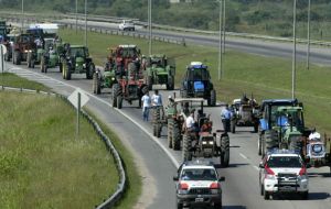 Tractors, harvesters, trucks protest property tax hikes 