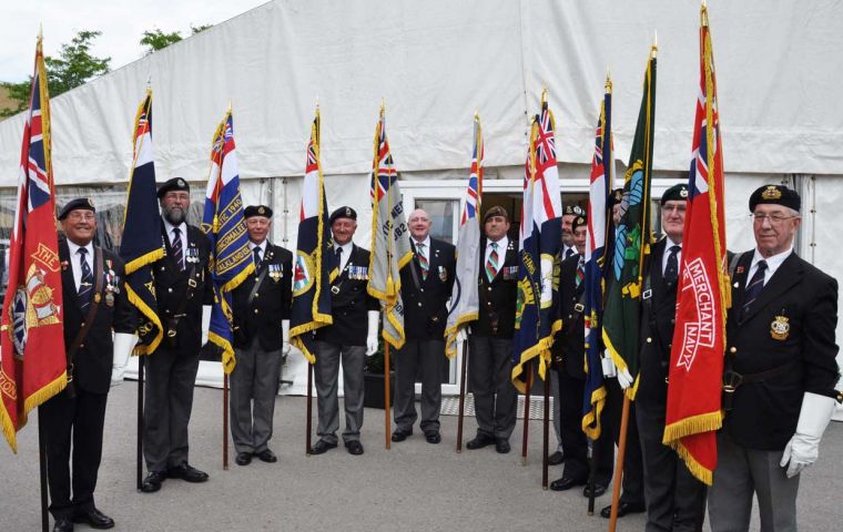 Veterans organisations pose with their colours