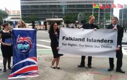 Young Falkland Islanders with a banner displayed before the UN building in New York (Photo: BBC) 