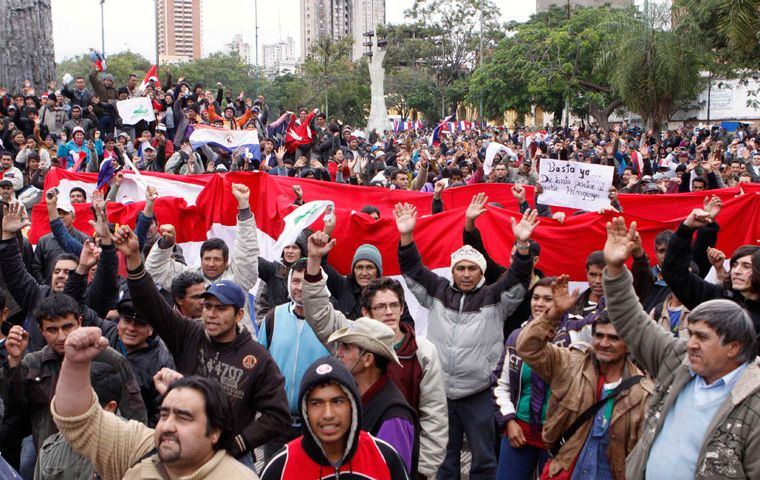 Supporters of President Lugo assemble in the main square across from the Senate